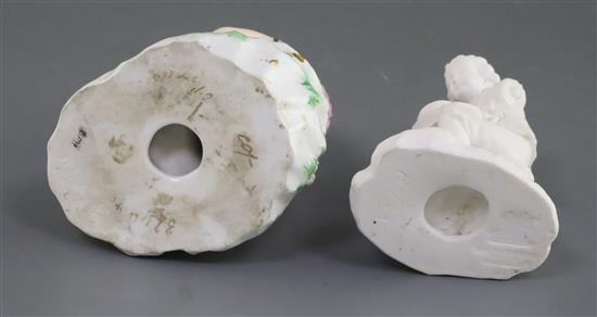 Two Rockingham porcelain figures of a girl seated with a lamb and a boy seated on a basket, c.1830, h.10.5cm, losses